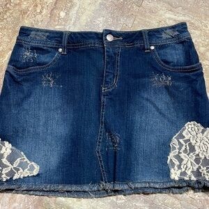 Venus women’s denim skirt, distressed look. Size 12.